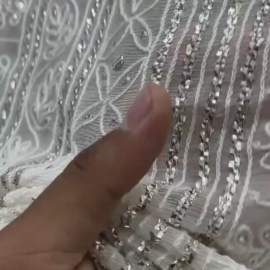 Shop the new arrival 7-gaz pure China crinkle chiffon saree featuring R-Mukesh, thread aari, and pure white silver Mukesh work. Perfect for weddings and formal wear.