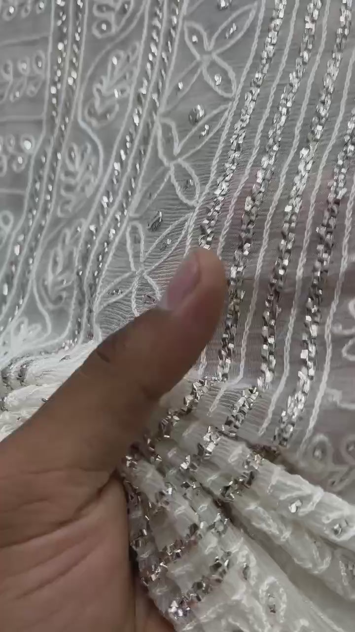 Shop the new arrival 7-gaz pure China crinkle chiffon saree featuring R-Mukesh, thread aari, and pure white silver Mukesh work. Perfect for weddings and formal wear.